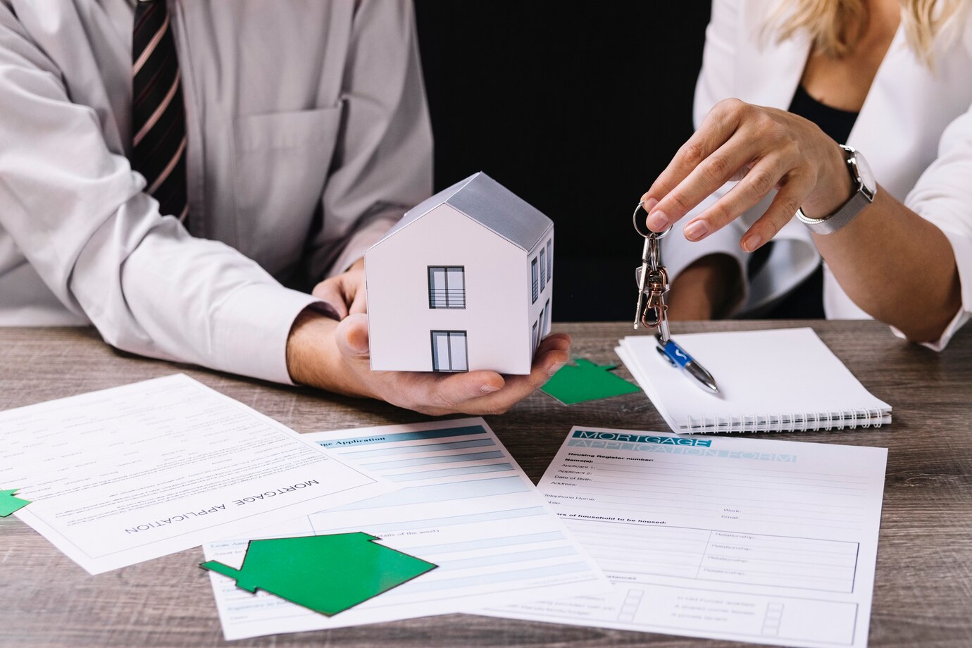 realtor-giving-keys-new-owner_23-2147764253